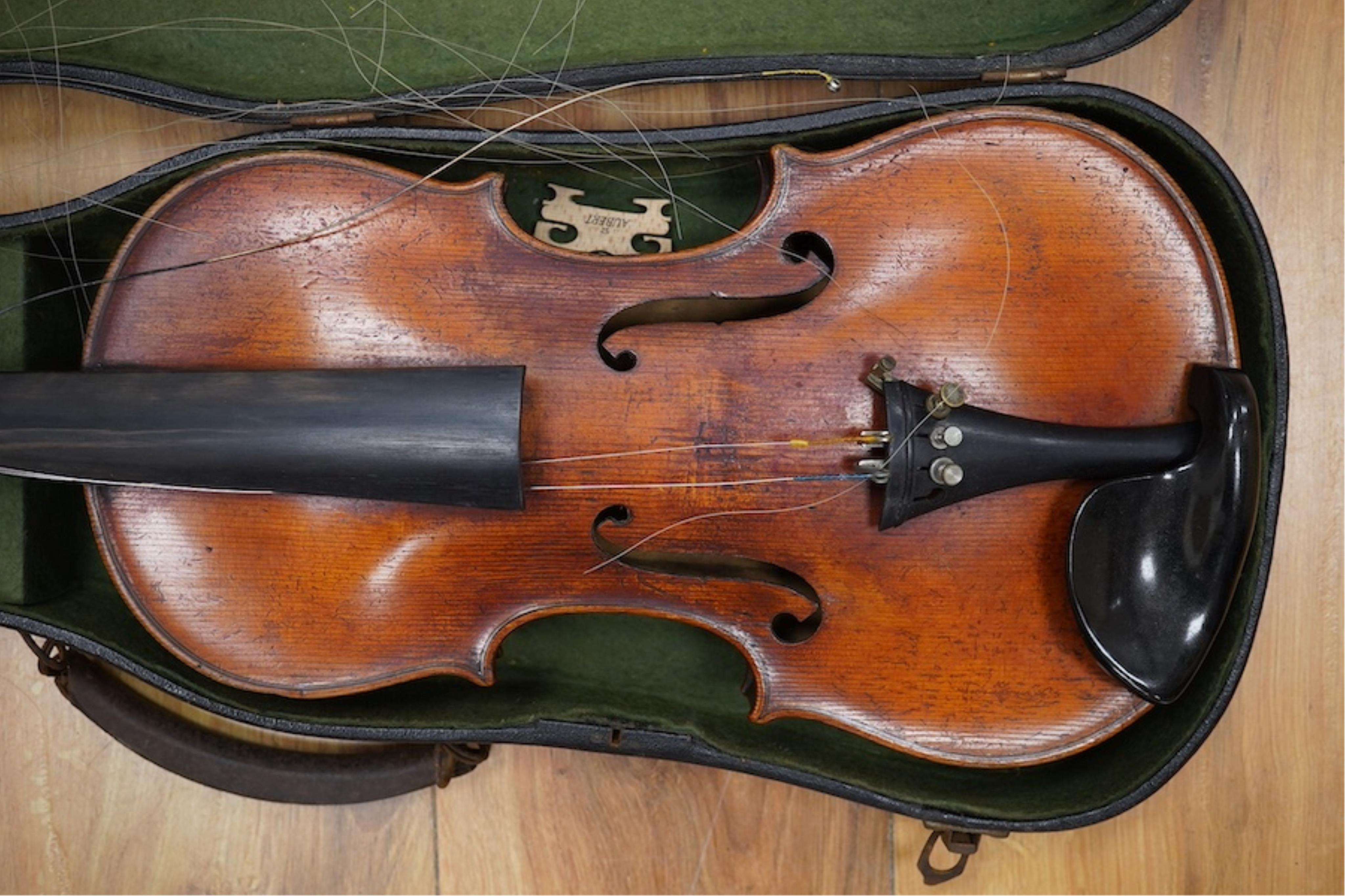 A late 19th cased century French unmarked violin and bow, body 35cm high.